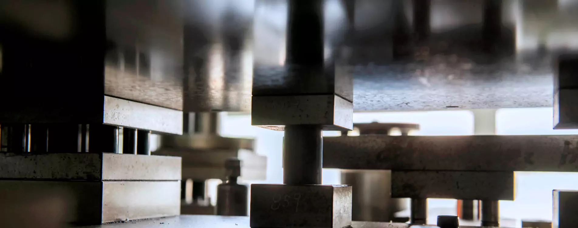 Progressive stamping die mounted in a press at the YBT plant in Taichung, Taiwan