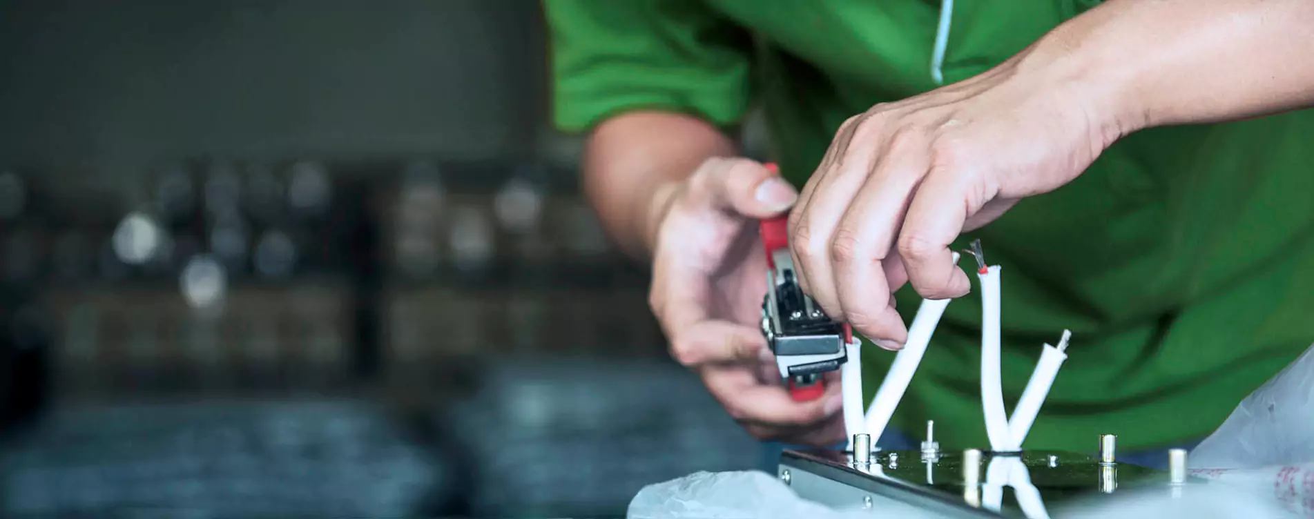 YBT operator assembling a gas appliance component on a fixture at the Taichung plant